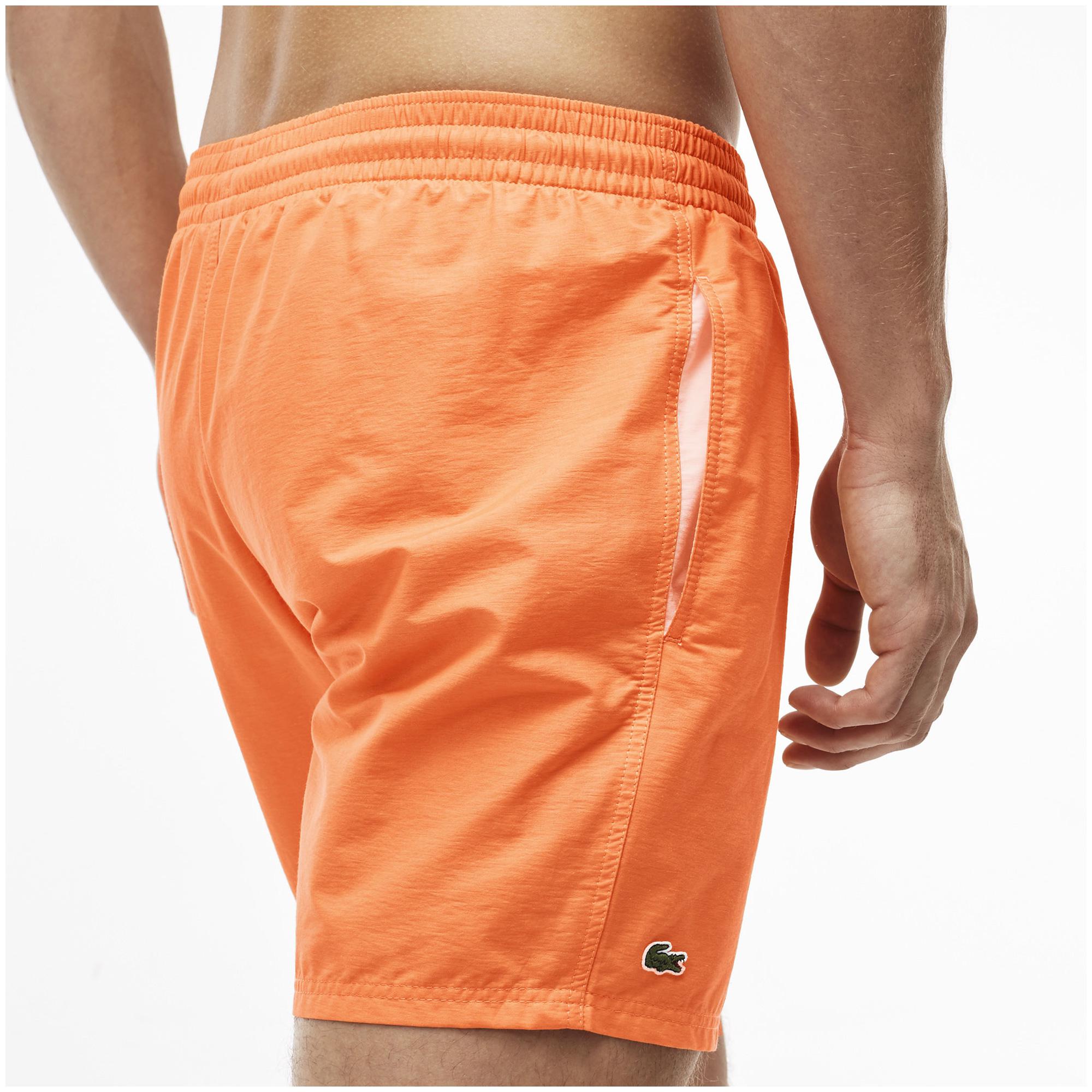orange lacoste joggers