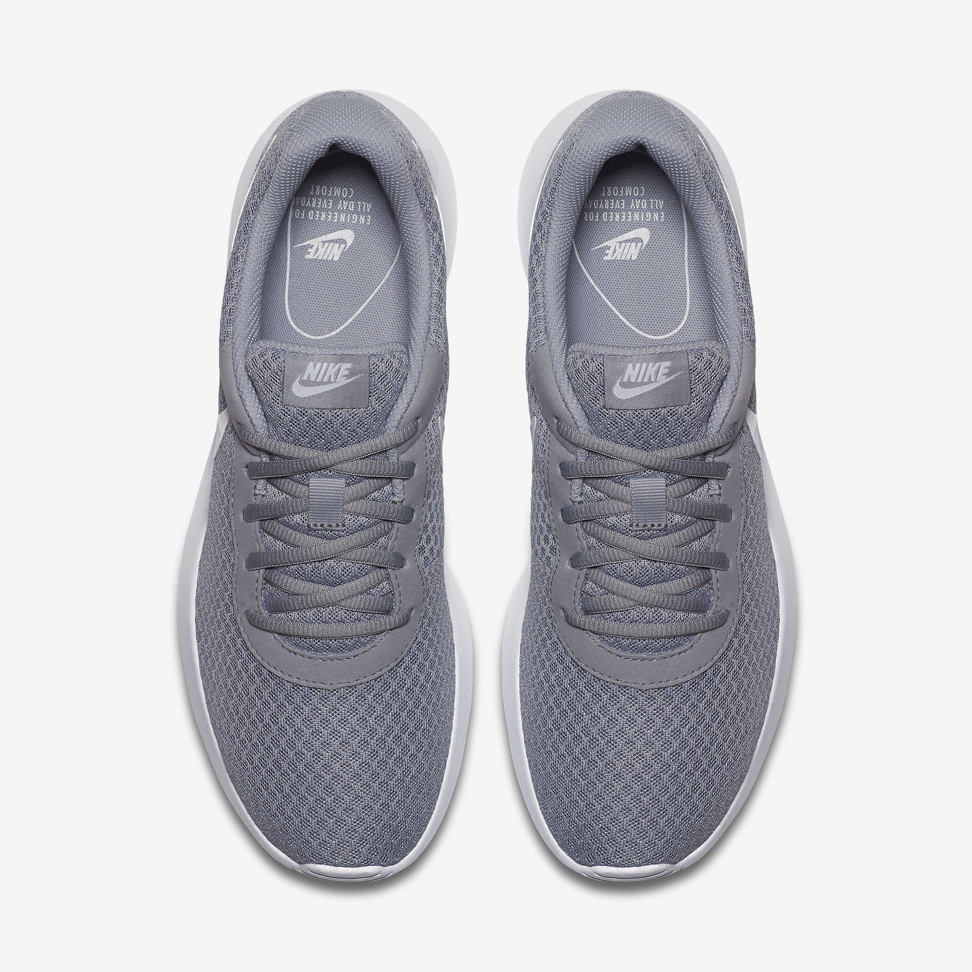white and grey nike tennis shoes