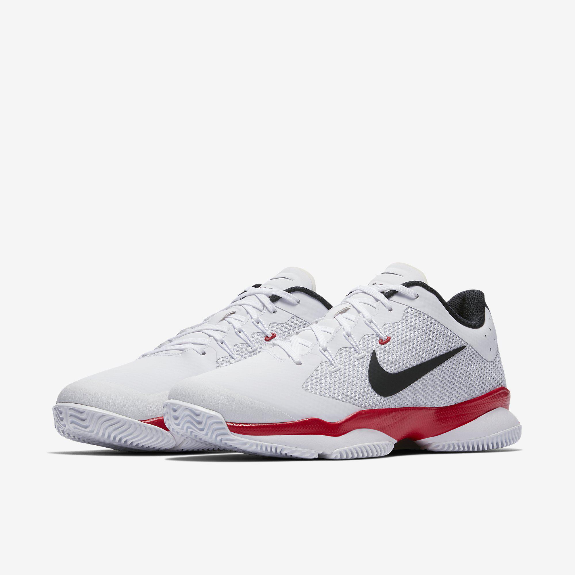 nike red and white tennis shoes