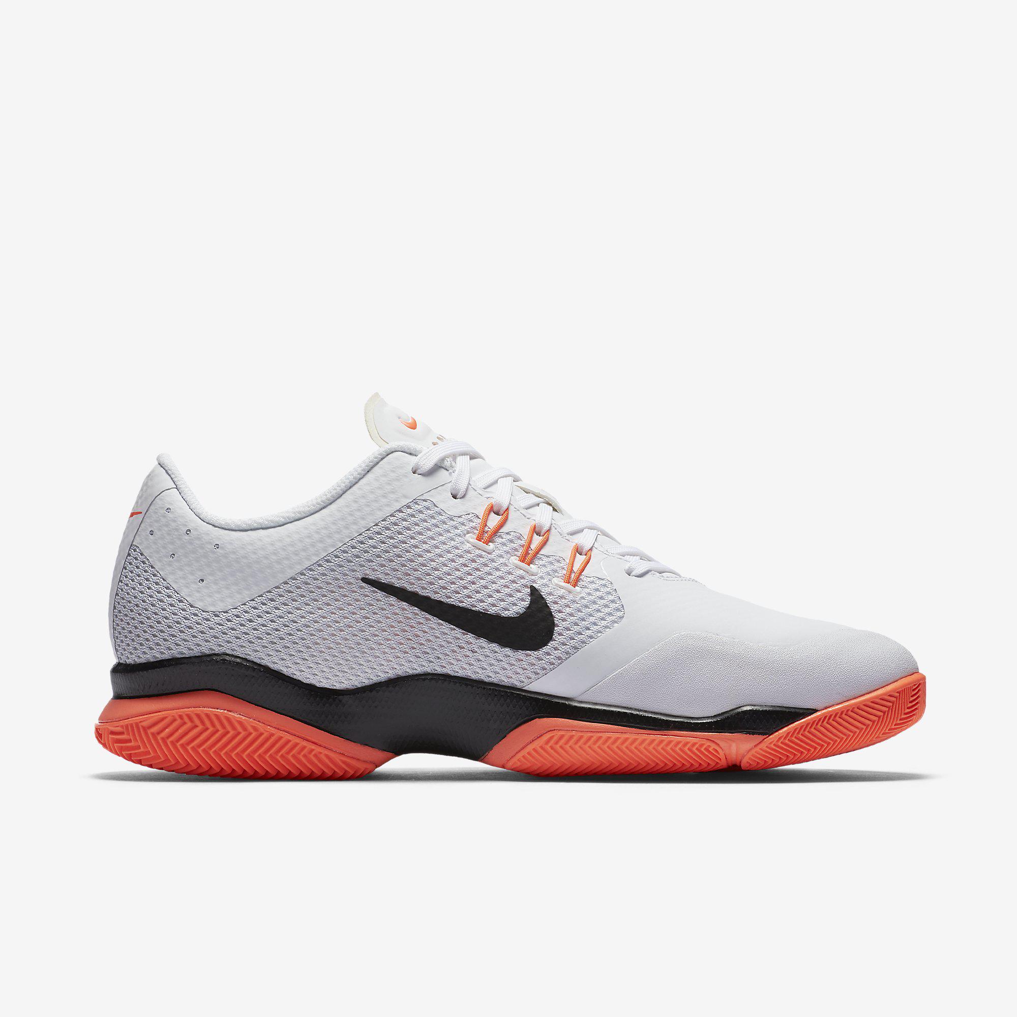 white and orange nike zoom
