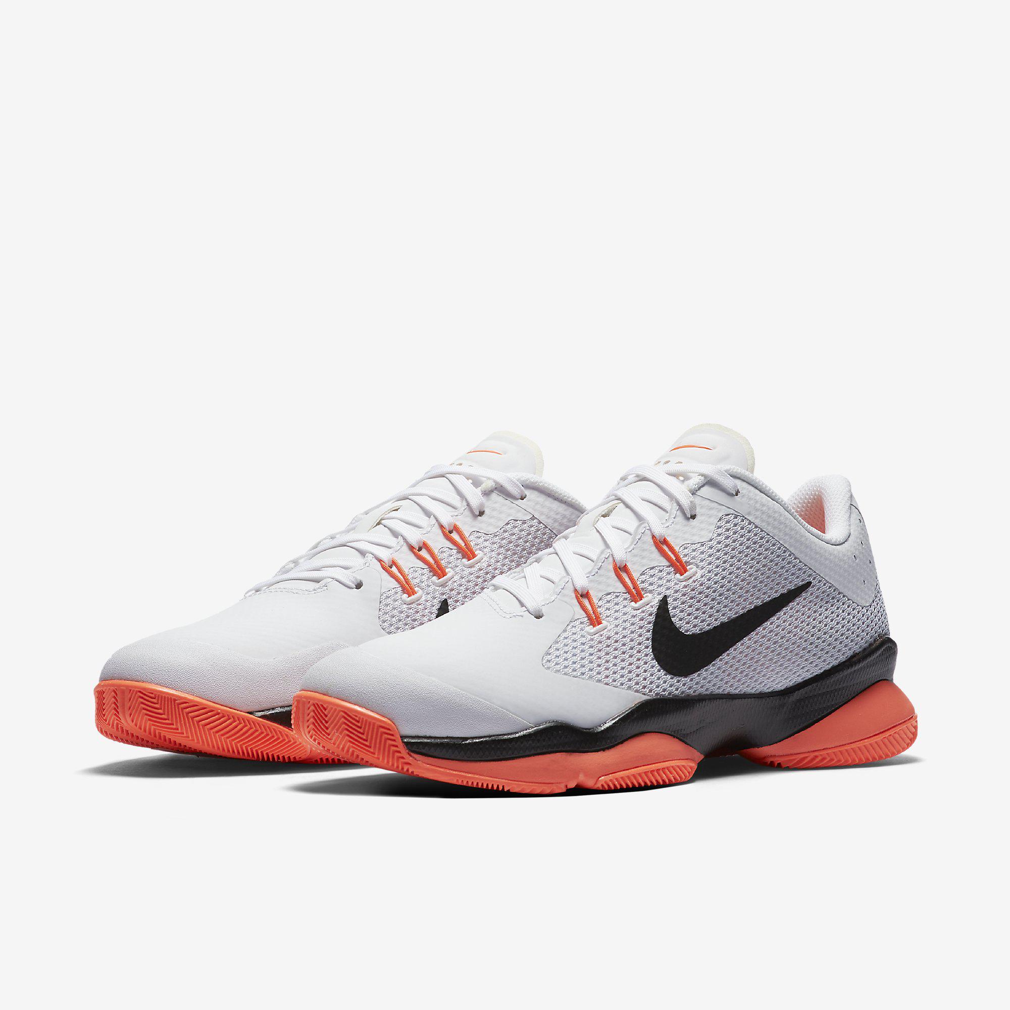 white and orange nike zoom