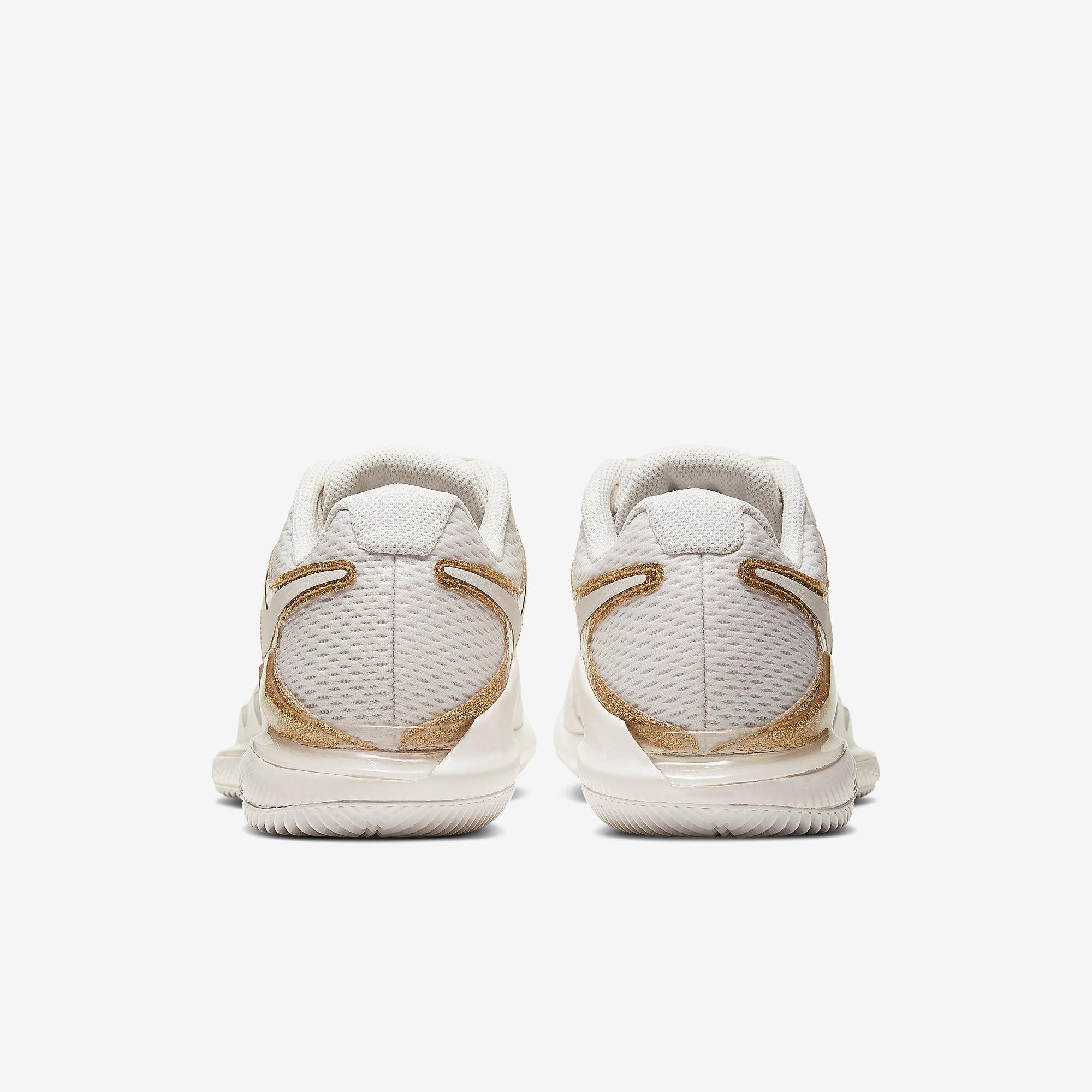 nike tennis shoes gold