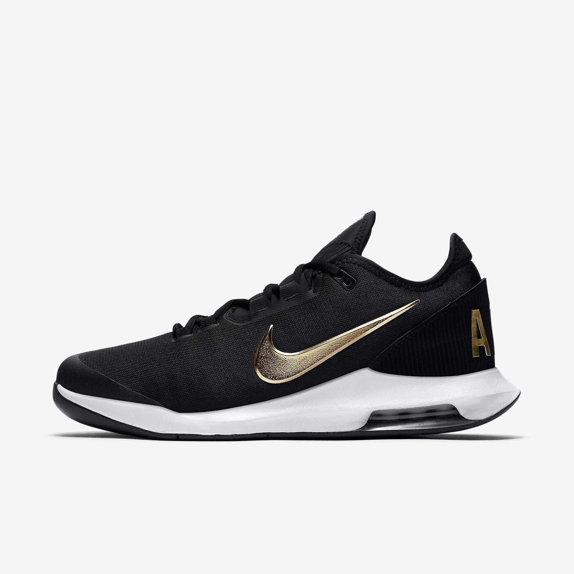 nike black and gold tennis shoes