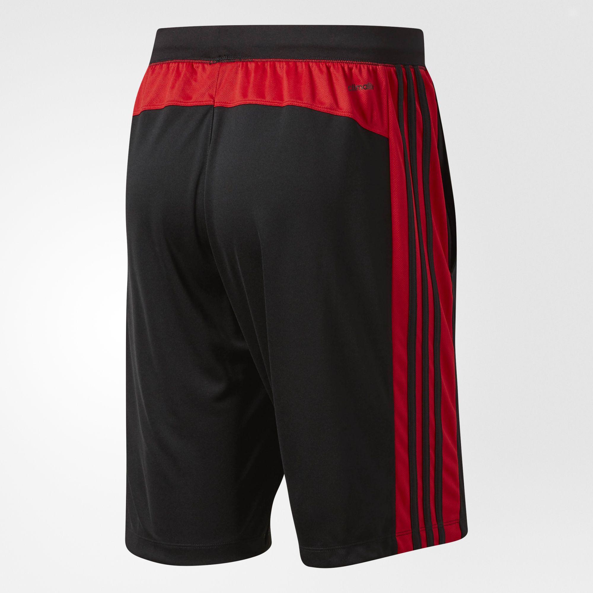 black adidas shorts with red stripes